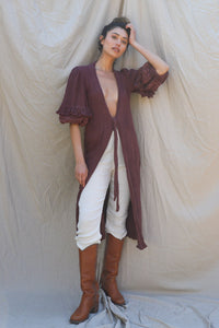 burgundy kimono hits just past knee, is open in front with self-tie at waist