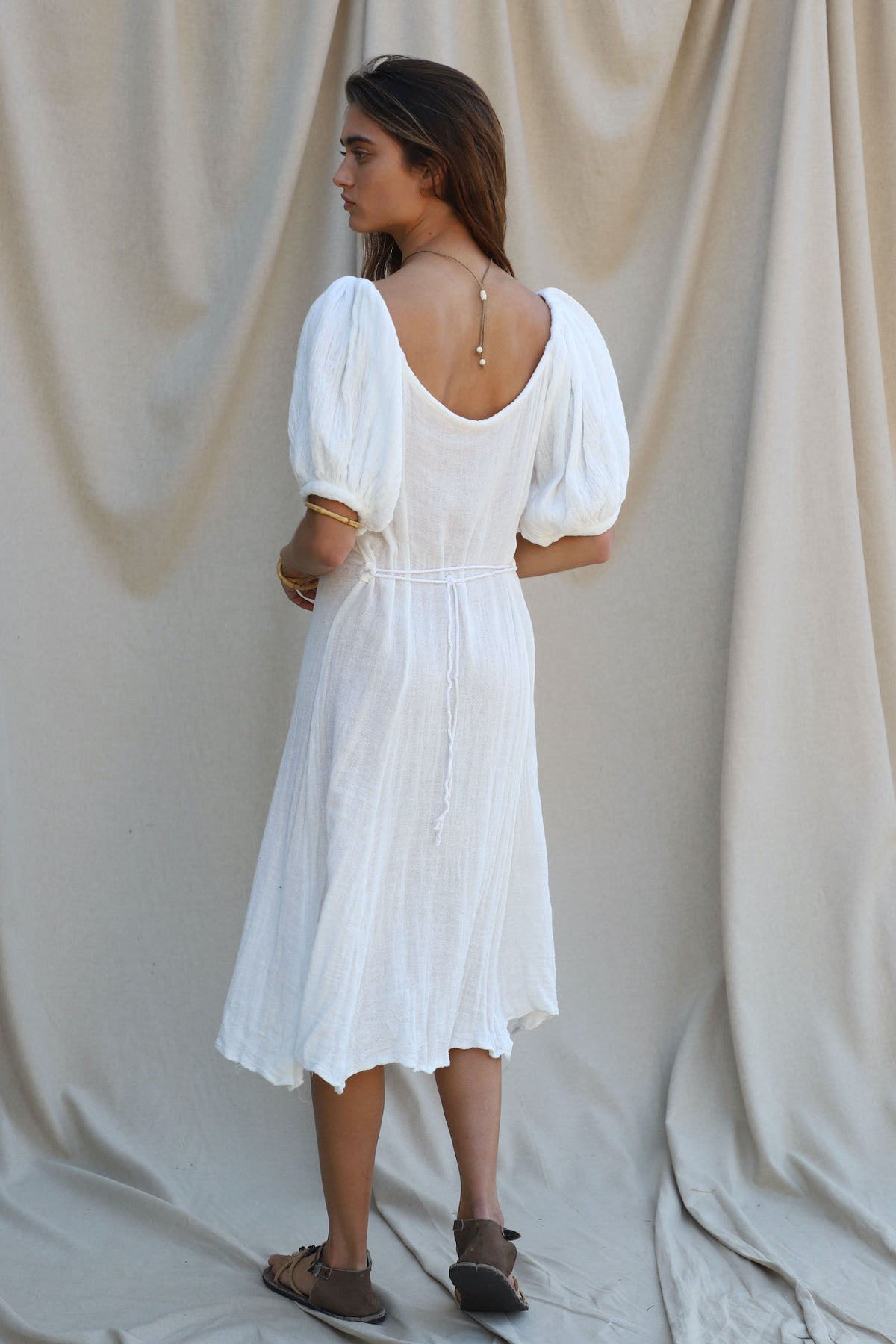 white gauze midi dress with short sleeves and tie detail at back 